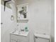 Small bathroom with shower, sink and toilet. The white paint needs some TLC at 200 W Louisiana Ave, Tampa, FL 33603
