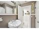 Bathroom with vanity, mirror, and open doorway at 200 W Louisiana Ave, Tampa, FL 33603