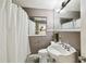 Bathroom with shower curtain, vanity and mirror at 200 W Louisiana Ave, Tampa, FL 33603