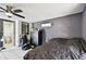 View of the bedroom with a ceiling fan and showing an ensuite bathroom and a closet at 200 W Louisiana Ave, Tampa, FL 33603