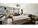 Comfortable bedroom featuring natural light and a ceiling fan at 200 W Louisiana Ave, Tampa, FL 33603