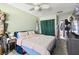 Bedroom with a large bed, ceiling fan, and a closet at 200 W Louisiana Ave, Tampa, FL 33603