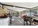 Wide-angle shot of garage with washing machine, exercise equipment, and table at 200 W Louisiana Ave, Tampa, FL 33603