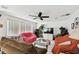 Living room featuring tile floors, ceiling fan, and lots of furniture at 200 W Louisiana Ave, Tampa, FL 33603