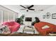 Living room featuring tile floors, ceiling fan, lots of furniture, and large speakers at 200 W Louisiana Ave, Tampa, FL 33603