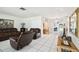 Open living space with tile flooring and view to dining room at 200 W Louisiana Ave, Tampa, FL 33603