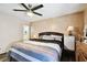 A bright, spacious main bedroom features attractive wall texture, wood floors and a ceiling fan at 200 W Louisiana Ave, Tampa, FL 33603