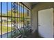 View from the porch through decorative security bars at 200 W Louisiana Ave, Tampa, FL 33603
