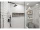 Updated bathroom featuring a glass enclosed shower with white subway tiles and decorative accent at 10607 Carrollbrook Way # 10607, Tampa, FL 33618