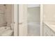 This bathroom features a tiled shower, tub and a view to the bedroom at 10714 Torchwood Sea Way, San Antonio, FL 33576