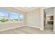 A room with luxury vinyl flooring next to the kitchen at 10714 Torchwood Sea Way, San Antonio, FL 33576