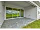 Covered patio featuring stylish pavers, offering a perfect space for outdoor relaxation and entertainment at 10714 Torchwood Sea Way, San Antonio, FL 33576