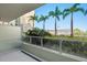 Spacious balcony with glass railing offers scenic views of swaying palm trees and a cruise ship at 111 N 12Th St # 1314, Tampa, FL 33602