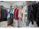 Organized walk-in closet with plenty of hanging space and storage shelves at 111 N 12Th St # 1314, Tampa, FL 33602