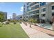 Exterior view showing a lush green courtyard area and outdoor spa and seating at 111 N 12Th St # 1314, Tampa, FL 33602