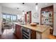 Gourmet kitchen island with open storage and stainless steel appliances at 111 N 12Th St # 1314, Tampa, FL 33602