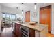 Contemporary kitchen with stainless steel appliances, a granite countertop, and wood cabinets at 111 N 12Th St # 1314, Tampa, FL 33602