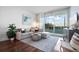 Cozy living room with sliding glass doors to a private balcony at 111 N 12Th St # 1314, Tampa, FL 33602