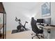 Functional office space with desk, chair, computer, and stationary bike in a well-lit environment at 111 N 12Th St # 1314, Tampa, FL 33602