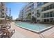 Inviting pool surrounded by lounge chairs and palm trees, offering a serene and relaxing atmosphere at 111 N 12Th St # 1314, Tampa, FL 33602
