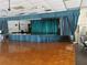 Auditorium features a stage with blue curtains and a hardwood floor at 11251 80Th Ave # 210, Seminole, FL 33772