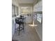 Enclosed patio area with a metal table set and views of the outdoors at 11251 80Th Ave # 210, Seminole, FL 33772