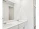 Modern bathroom featuring double sinks and shower with glass door at 129 Whiteland Bnd, Nokomis, FL 34275