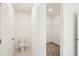 Bright bathroom features a toilet and a small closet space perfect for a guest at 129 Whiteland Bnd, Nokomis, FL 34275