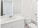 Clean bathroom with white vanity, sink, toilet and a shower/tub combo at 129 Whiteland Bnd, Nokomis, FL 34275