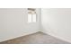 A vacant bedroom with neutral carpet and a window providing natural light at 129 Whiteland Bnd, Nokomis, FL 34275