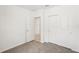 Bedroom featuring an open door, closet with sliding doors and neutral carpeting at 129 Whiteland Bnd, Nokomis, FL 34275
