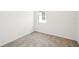 Bright bedroom with a window and neutral carpeting; great for a cozy retreat at 129 Whiteland Bnd, Nokomis, FL 34275