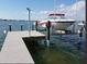 Dock and boat lift with a sleek design, ideal for easy watercraft access at 1310 Boca Ciega Isle Dr, St Pete Beach, FL 33706