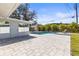 This backyard has a patio area leading to a sparkling pool at 1464 S Evergreen Ave, Clearwater, FL 33756