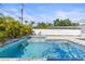 This is a backyard with a pool and a well maintained yard at 1464 S Evergreen Ave, Clearwater, FL 33756