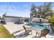 This is a backyard with a pool, patio, and a well maintained yard at 1464 S Evergreen Ave, Clearwater, FL 33756