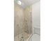 This bathroom features a glass enclosed shower with stylish tiling and a toilet at 1464 S Evergreen Ave, Clearwater, FL 33756
