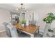 Dining room showcasing stylish chairs, decor, and an open flow to the updated kitchen at 1464 S Evergreen Ave, Clearwater, FL 33756
