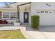 Inviting front entry featuring a decorative front door and well-maintained landscaping at 1464 S Evergreen Ave, Clearwater, FL 33756