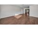 Spacious living room featuring modern flooring and wainscoting, open to other rooms at 1633 Clearview Ave, Clearwater, FL 33756