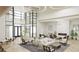 Spacious lobby with modern decor, comfortable seating, and fireplace at 18585 Watercolor Ave, Venice, FL 34293