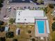 Aerial view features the community pool, community building, parking and green space at 2170 Americus S Blvd # 6, Clearwater, FL 33763