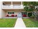 Charming front porch with outdoor seating, creating a cozy and inviting entrance to the home at 2170 Americus S Blvd # 6, Clearwater, FL 33763