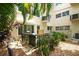 Private patio featuring lush landscaping and comfortable seating, ideal for enjoying the outdoors at 2170 Americus S Blvd # 6, Clearwater, FL 33763