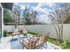 Cozy backyard patio with stylish outdoor furniture and a serene atmosphere, perfect for relaxation and entertaining at 2710 Chestnut Creek Pl, Brandon, FL 33510