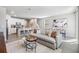 Bright, open-concept living space with a modern kitchen, dining area, and comfortable seating at 2710 Chestnut Creek Pl, Brandon, FL 33510