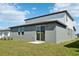 Backyard featuring a patio and expansive green space at 31640 Malbec Dr, Brooksville, FL 34602