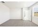 Bright bedroom featuring plush carpeting, base molding, and a doorway at 31640 Malbec Dr, Brooksville, FL 34602