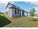 Charming home featuring manicured landscaping, a two-car garage, and a side entrance at 31640 Malbec Dr, Brooksville, FL 34602