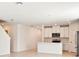 Open-concept kitchen features white cabinetry, stainless steel appliances, and lots of natural light at 31640 Malbec Dr, Brooksville, FL 34602